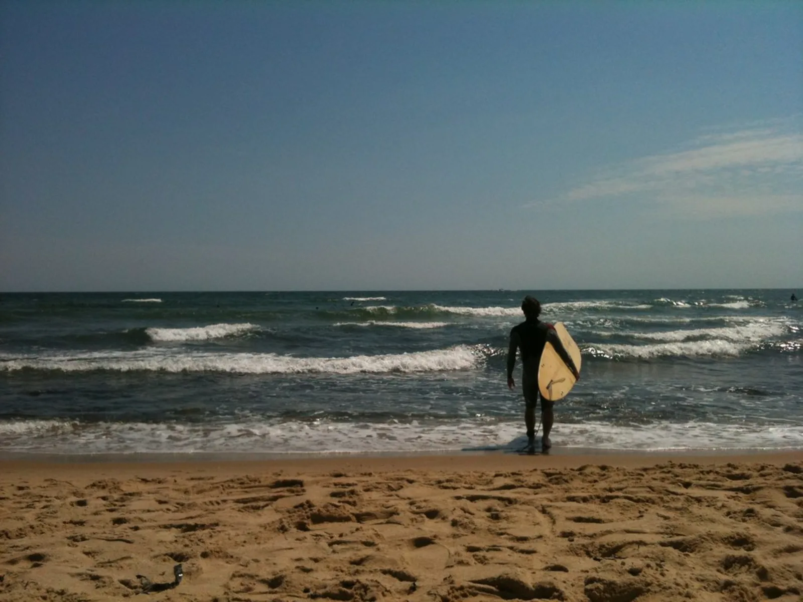 A surfer at Ditch Plains in Montauk, New York